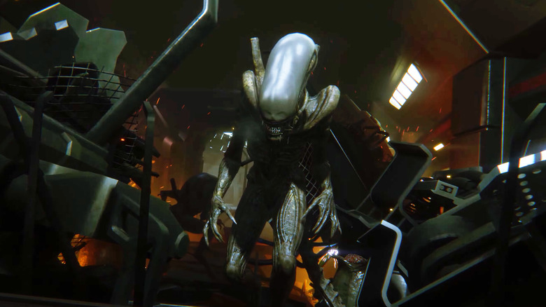 An alien walks amongst debris in Alien: Isolation