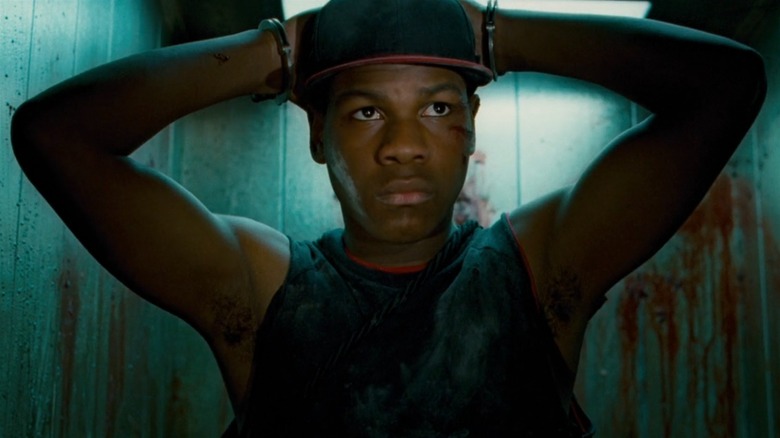 John Boyega with his hands on his head in Attack the Block