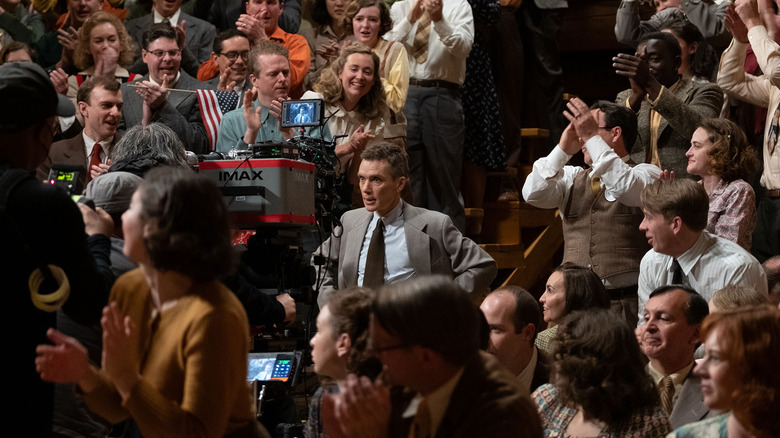 Oppenheimer clapping behind the scenes