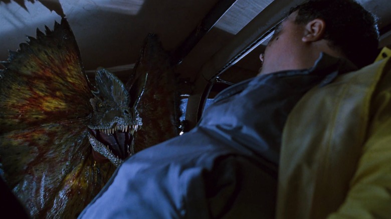 The dilophosaurus corners Nedry in Jurassic Park