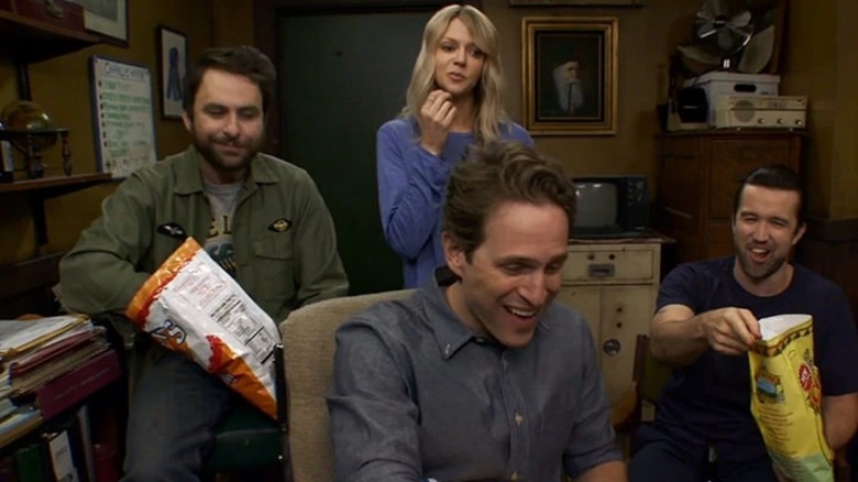 Dee Reynolds, Charlie Kelly, Dennis Reynolds, and Mac eating chips