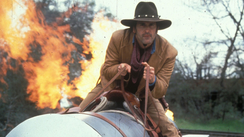 Brisco County Jr. rides away from fire