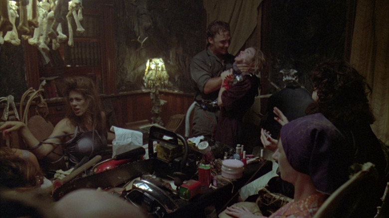 Vilmer holding knife to Jenny's throat in The Texas Chainsaw Massacre: The Next Generation